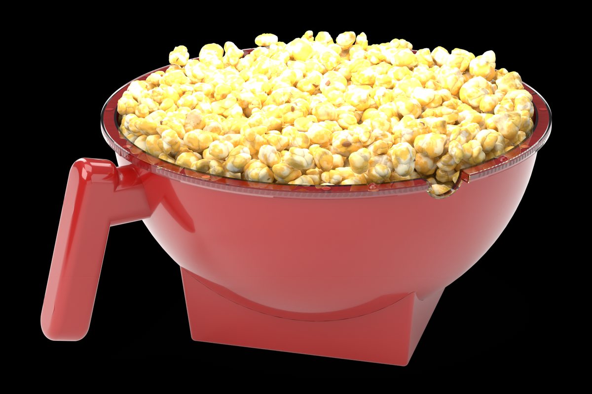 Bowl 1 of The Miracle Mixer, the red half with handle, filled with popcorn