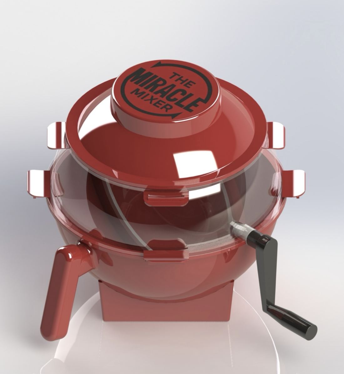 The Miracle Mixer red hand-crank mixing bowl with a clear dome
